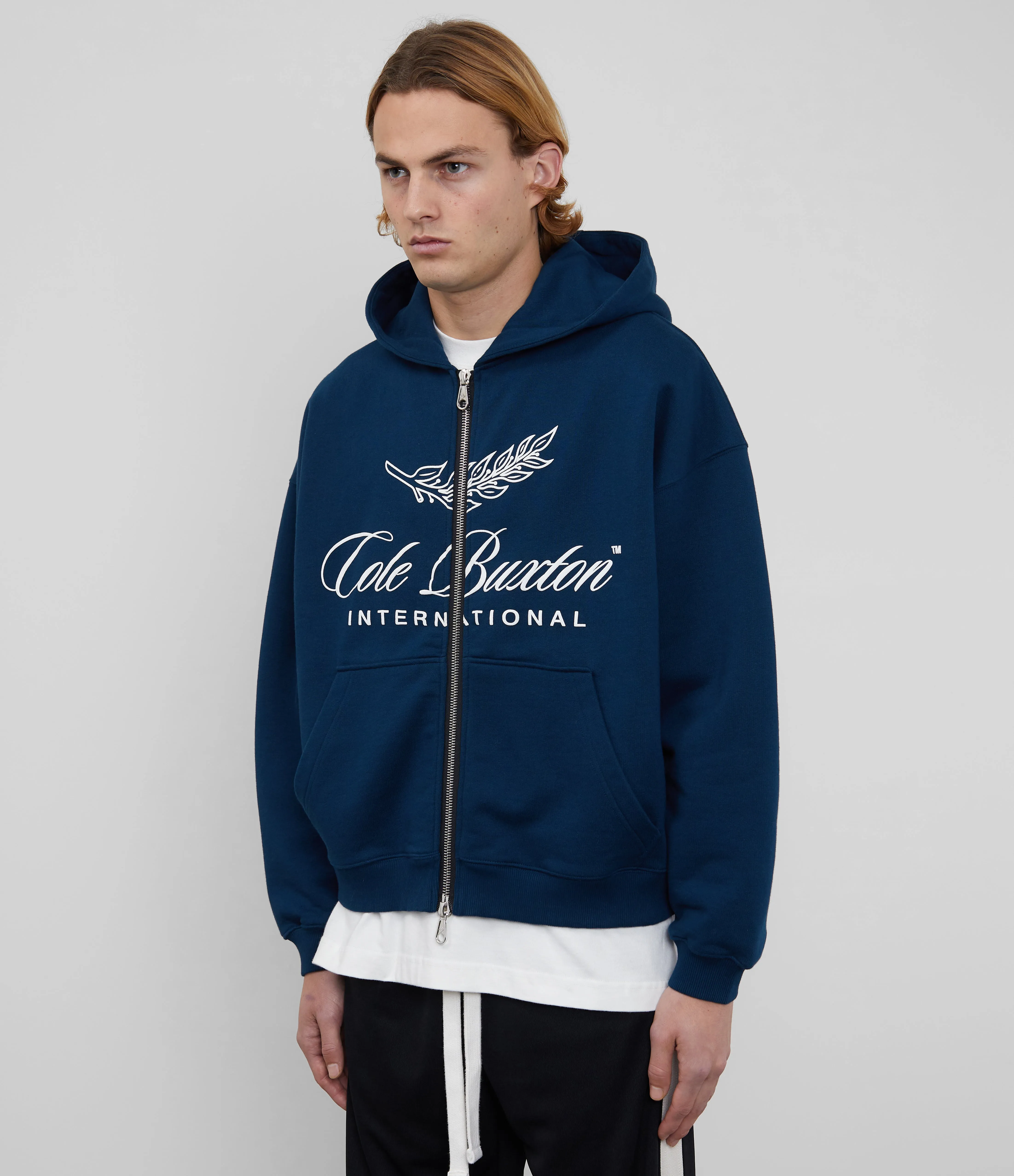 INTERNATIONAL ZIPPED HOODIE