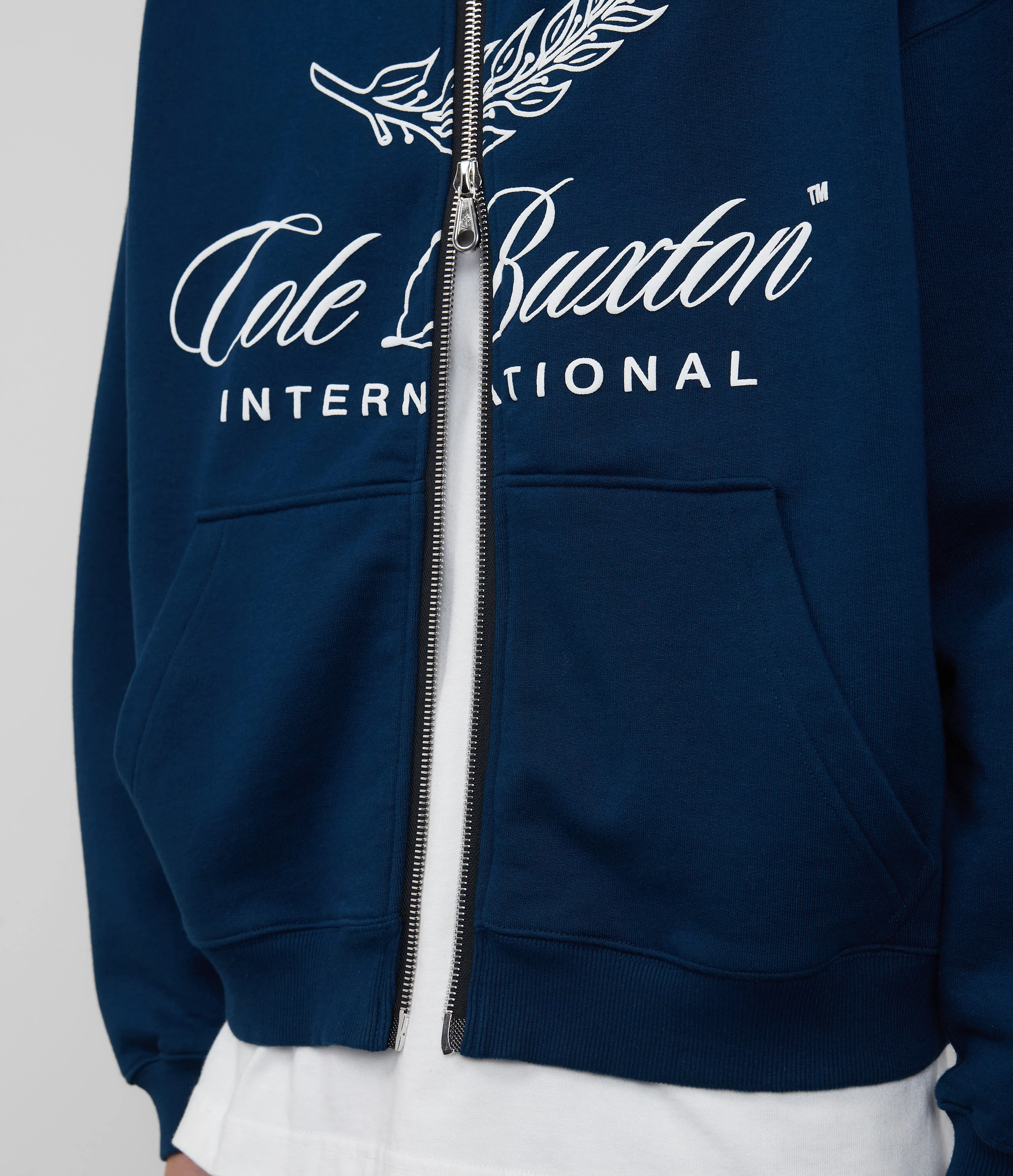 INTERNATIONAL ZIPPED HOODIE