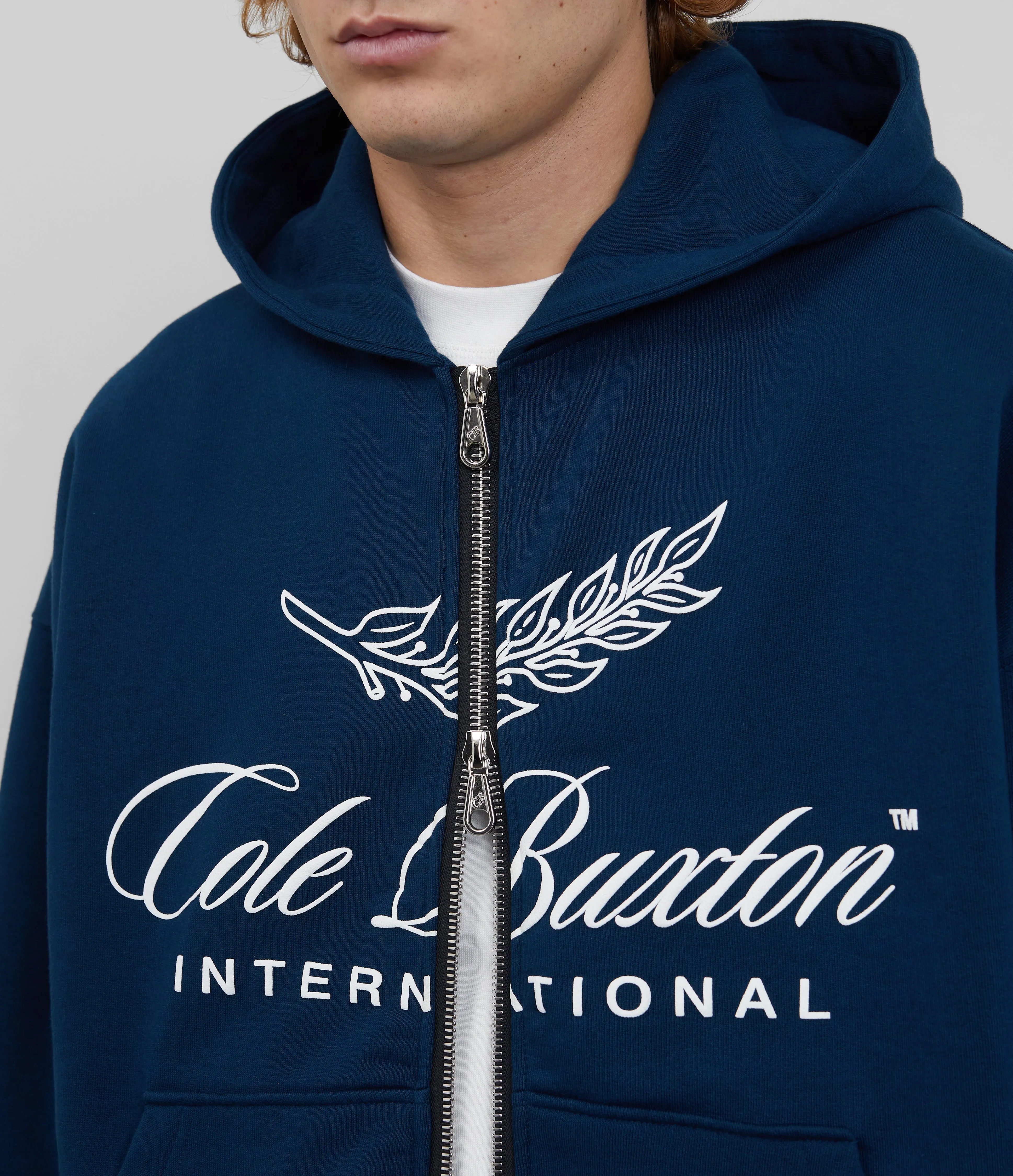 INTERNATIONAL ZIPPED HOODIE