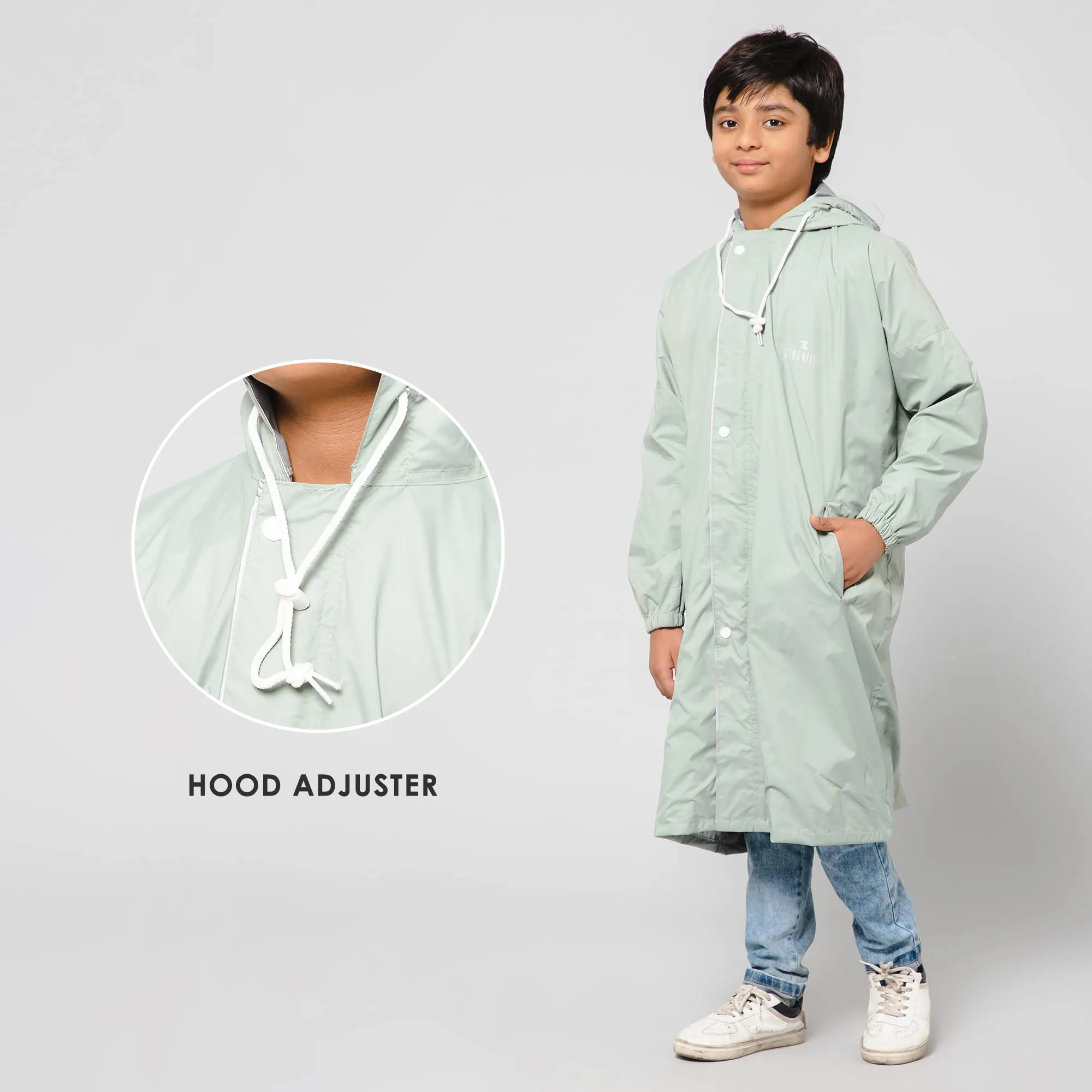 THE CLOWNFISH Cloud Chaser Series Kids Raincoat Waterproof Polyester Double Coating Reversible Longcoat with Hood and Reflector Logo at Back. Printed Plastic Pouch. Kid Age-7-8 years (Pista Green)