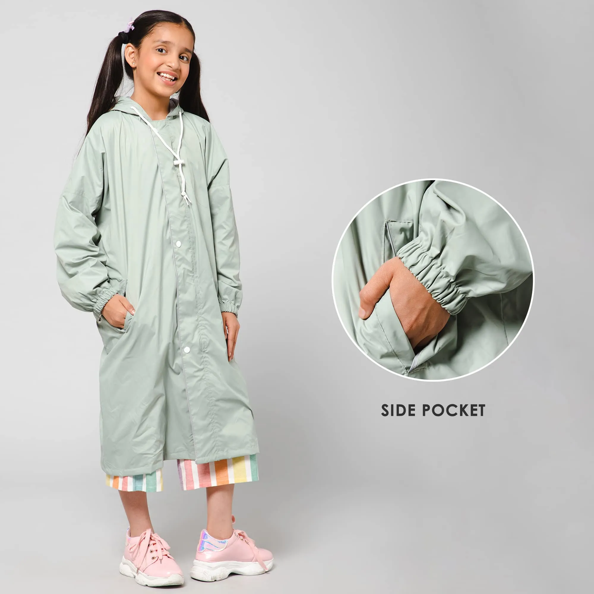 THE CLOWNFISH Cloud Chaser Series Kids Raincoat Waterproof Polyester Double Coating Reversible Longcoat with Hood and Reflector Logo at Back. Printed Plastic Pouch. Kid Age-7-8 years (Pista Green)